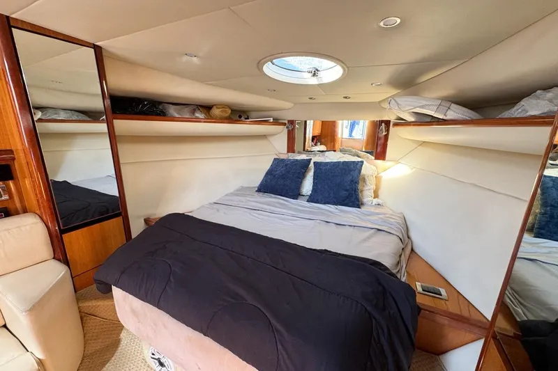 Slide: The Image of Luxurious cabin interior of 2004 Sunseeker Sportfisher 37 yacht with cozy bedding. - 94