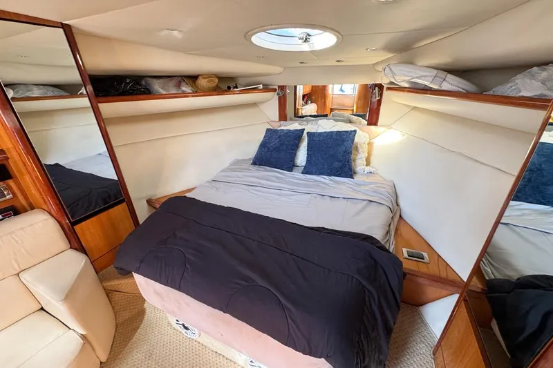 Slide: The Image of Luxurious cabin interior of 2004 Sunseeker Sportfisher 37 yacht with cozy bedding. - 95
