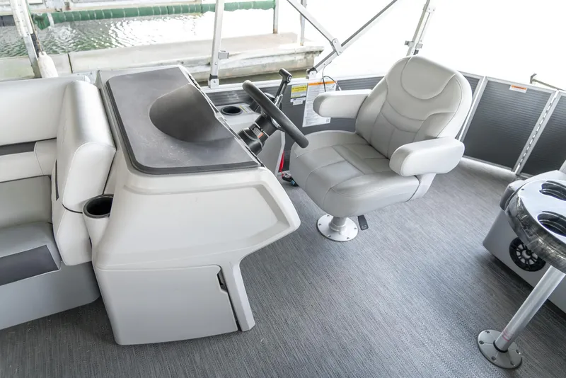 Slide: The Image of Captain's chair and helm of 2023 Godfrey Sweetwater 2186 C pontoon boat. - 12