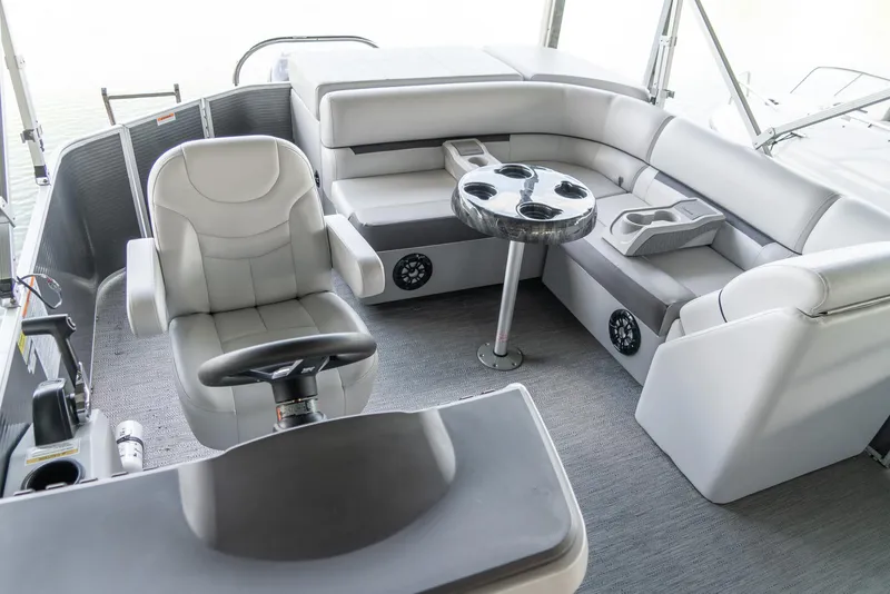 Slide: The Image of 2023 Godfrey Sweetwater 2186 C boat interior with plush seating and modern helm. - 13