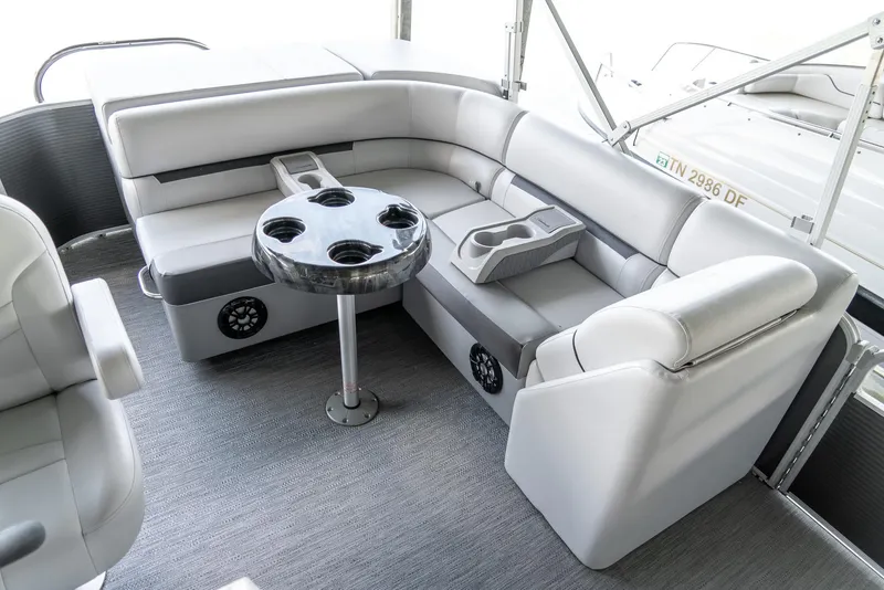 Slide: The Image of 2023 Godfrey Sweetwater 2186 C pontoon boat interior with gray seating and cupholders. - 14