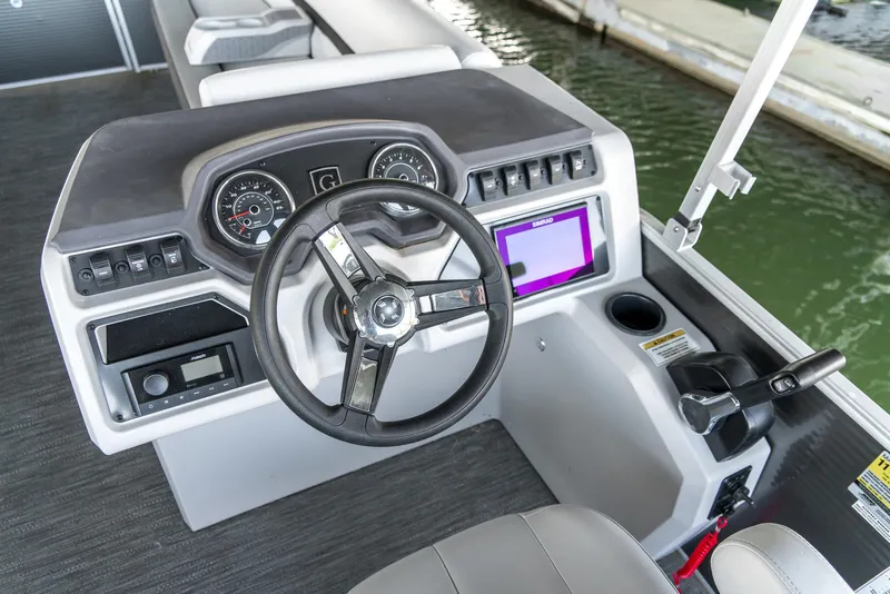 Slide: The Image of 2023 Godfrey Sweetwater 2186 C boat dashboard with steering wheel and control panel. - 20
