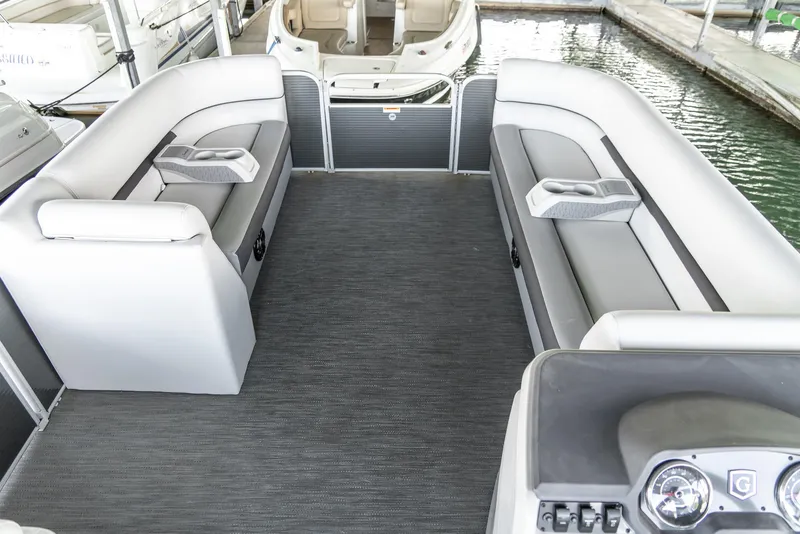 Slide: The Image of 2023 Godfrey Sweetwater 2186 C pontoon boat interior with gray seating and carpet. - 22