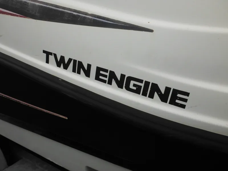 Slide: The Image of 2008 Yamaha SX210 boat with "Twin Engine" label on the hull. - 10