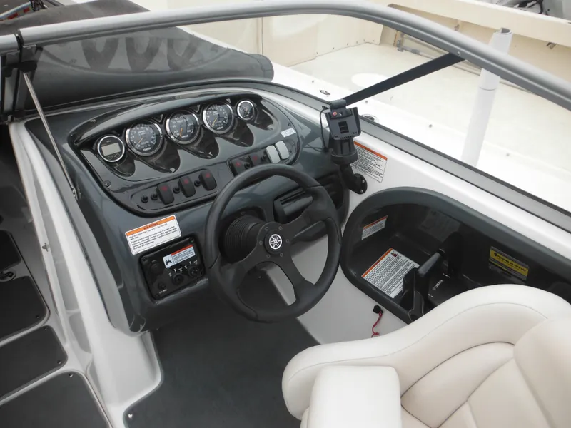 Slide: The Image of 2008 Yamaha Boats SX210 dashboard with steering wheel and control panel. - 19
