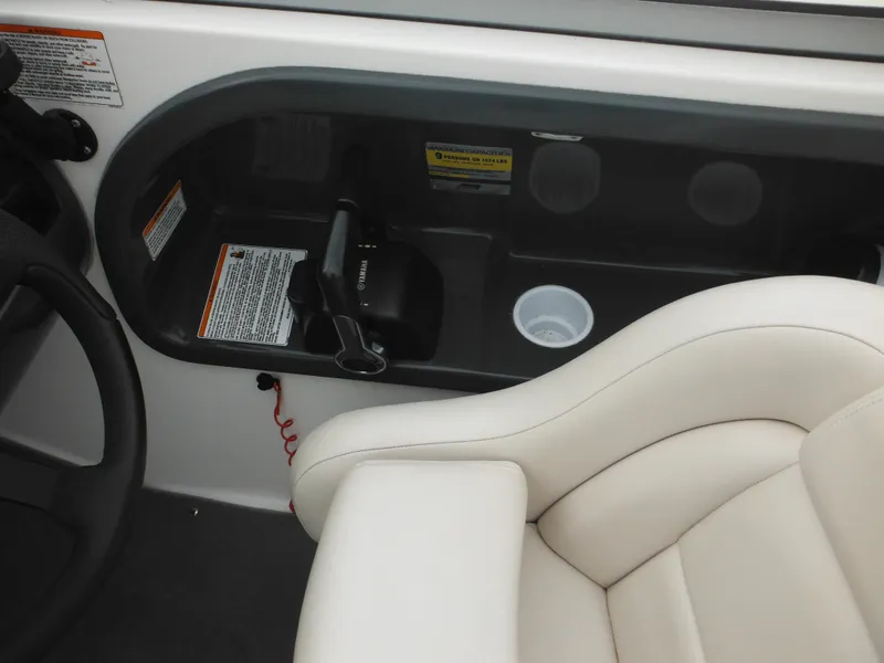 Slide: The Image of 2008 Yamaha SX210 boat interior with steering wheel, throttle, and cushioned seat. - 20