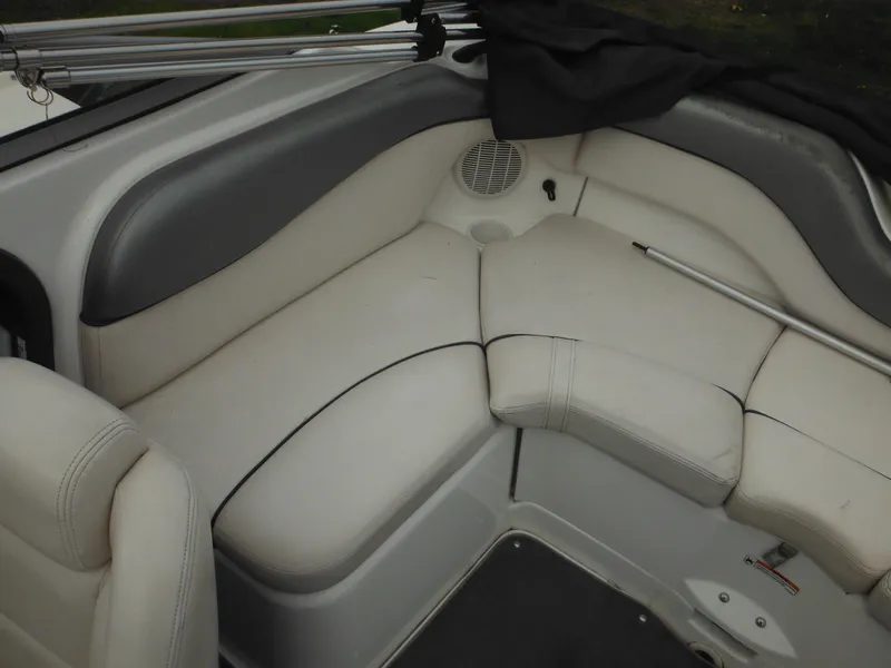 Slide: The Image of 2008 Yamaha SX210 boat interior with white cushioned seating and speaker. - 21