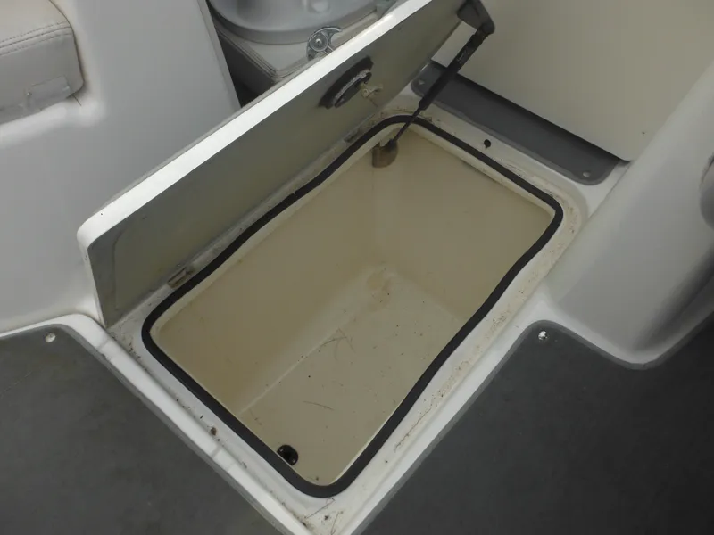 Slide: The Image of Open storage compartment on a 2008 Yamaha Boats SX210. - 27