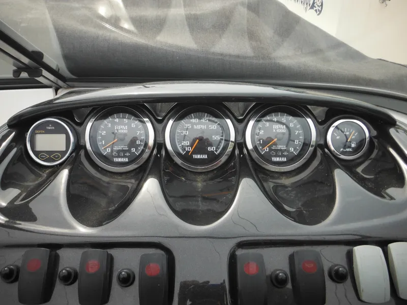 Slide: The Image of Dashboard of a 2008 Yamaha Boats SX210, featuring gauges and controls. - 28
