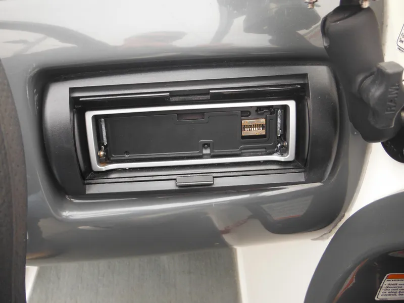 Slide: The Image of 2008 Yamaha SX210 boat dashboard with a stereo or electronic device slot. - 29