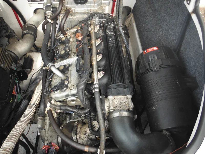 Slide: The Image of 2008 Yamaha Boats SX210 engine compartment with visible components and wiring. - 34