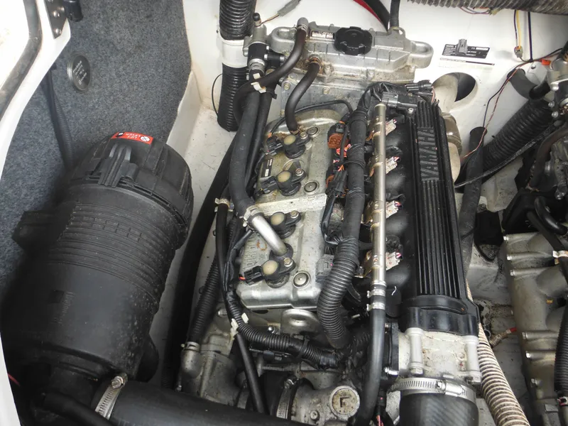 Slide: The Image of Engine compartment of a 2008 Yamaha Boats SX210, showcasing detailed components and wiring. - 35