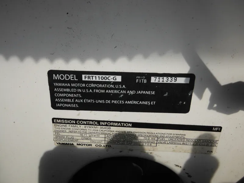 Slide: The Image of Yamaha SX210 2008 model label with emission control information and assembly details. - 38