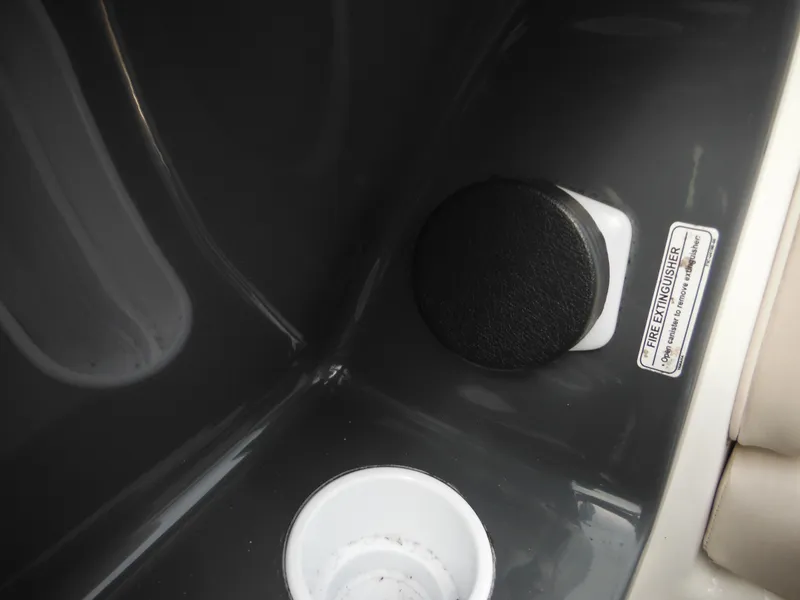 Slide: The Image of 2008 Yamaha Boats SX210 interior detail with cup holder and control knob. - 42