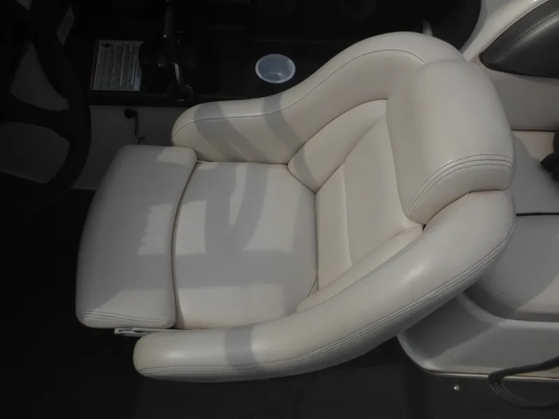 Slide: The Image of 2008 Yamaha Boats SX210 interior seat, featuring white cushioned upholstery. - 43