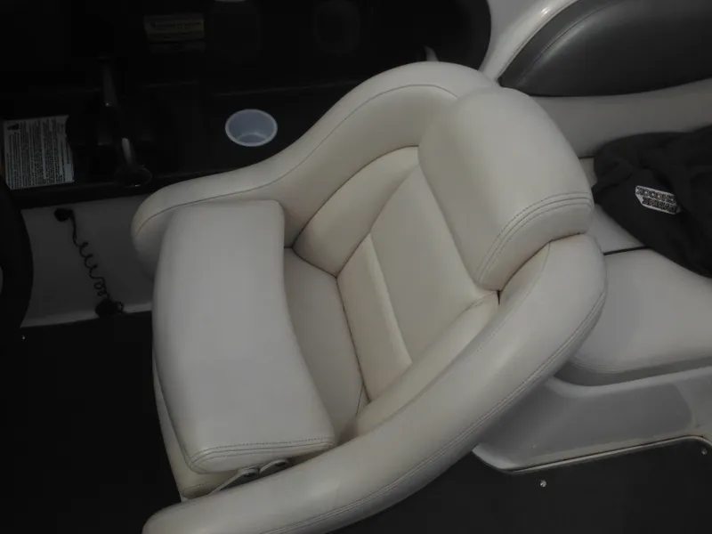 Slide: The Image of 2008 Yamaha SX210 boat interior with a plush, white captain's chair. - 44
