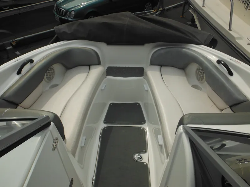 Slide: The Image of 2008 Yamaha Boats SX210 interior with cushioned seating and sleek design. - 45