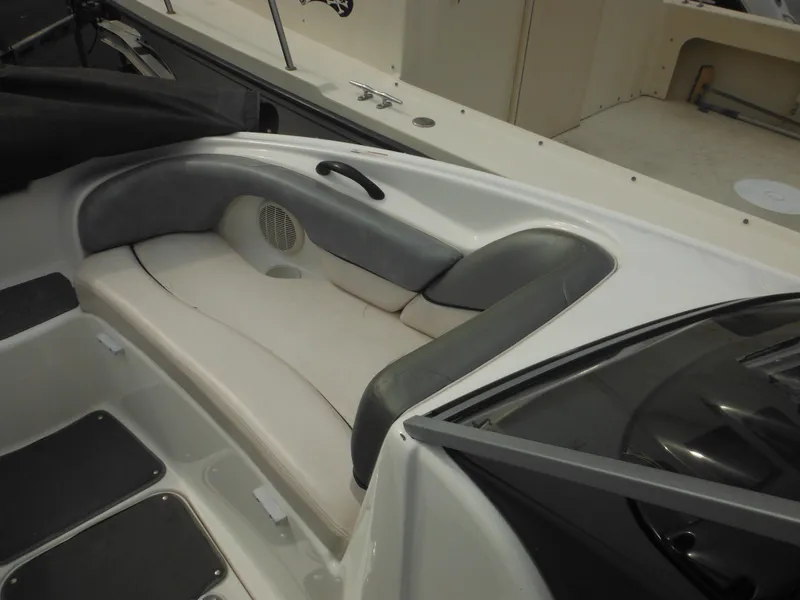 Slide: The Image of 2008 Yamaha SX210 boat interior seating with gray and white upholstery. - 46