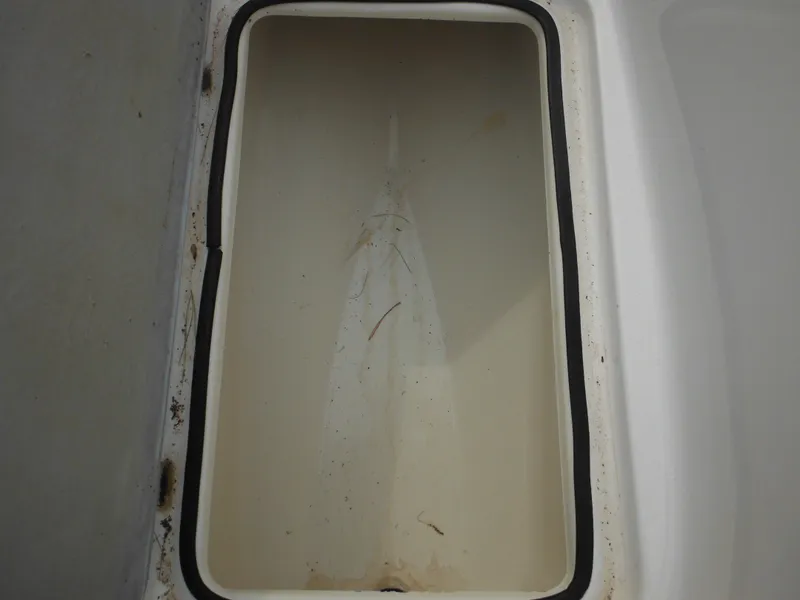 Slide: The Image of Empty storage compartment of a 2008 Yamaha SX210 boat. - 48