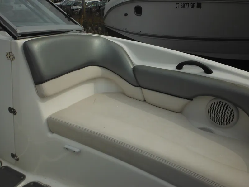 Slide: The Image of 2008 Yamaha Boats SX210 interior seating with gray and white upholstery. - 49