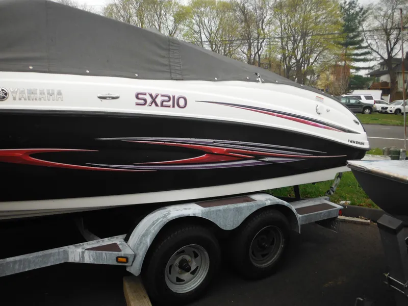 Slide: The Image of 2008 Yamaha Boats SX210 on trailer, covered, parked outdoors. - 9