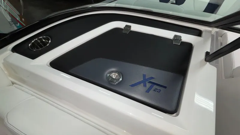 Slide: The Image of 2025 MasterCraft XT23 boat deck with sleek design and logo detailing. - 11