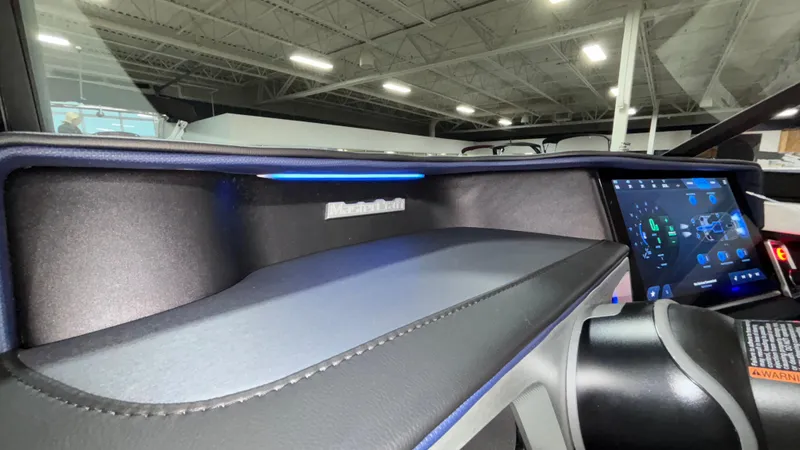 Slide: The Image of 2025 MasterCraft XT23 dashboard with touchscreen display and sleek interior design. - 19