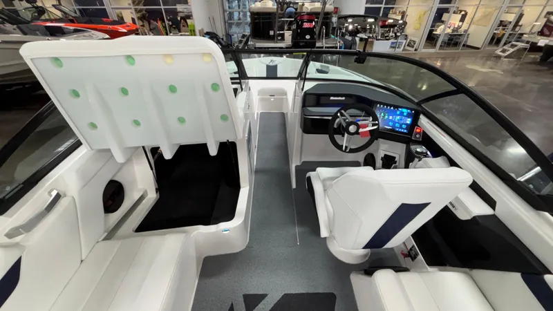 Slide: The Image of 2025 MasterCraft XT23 boat interior with modern dashboard and seating. - 22