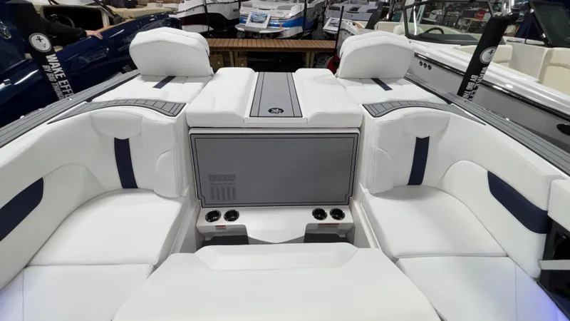 Slide: The Image of 2025 MasterCraft XT23 boat interior with white seating and modern design. - 25