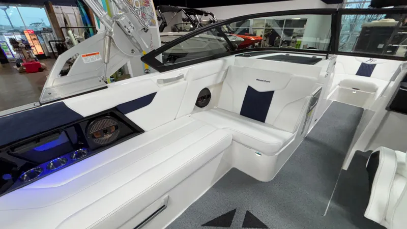Slide: The Image of 2025 MasterCraft XT23 boat interior with white seating and modern design. - 6