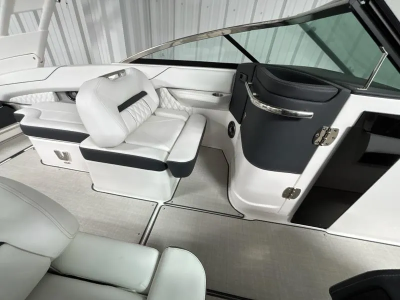 Slide: The Image of Luxurious interior of 2026 Regal LX4 boat with white seating and sleek design. - 15