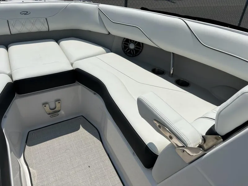 Slide: The Image of 2026 Regal LX4 boat interior with white leather seating and speaker system. - 9