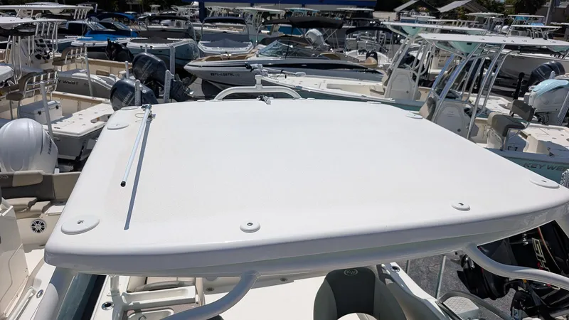 Slide: The Image of 2025 Key West 239 DFS boat, top view, surrounded by other boats in a marina. - 17