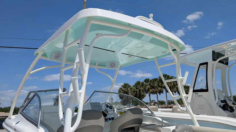 Slide: The Image of 2025 Key West 239 DFS boat with sleek design and modern features under a clear blue sky. - 18