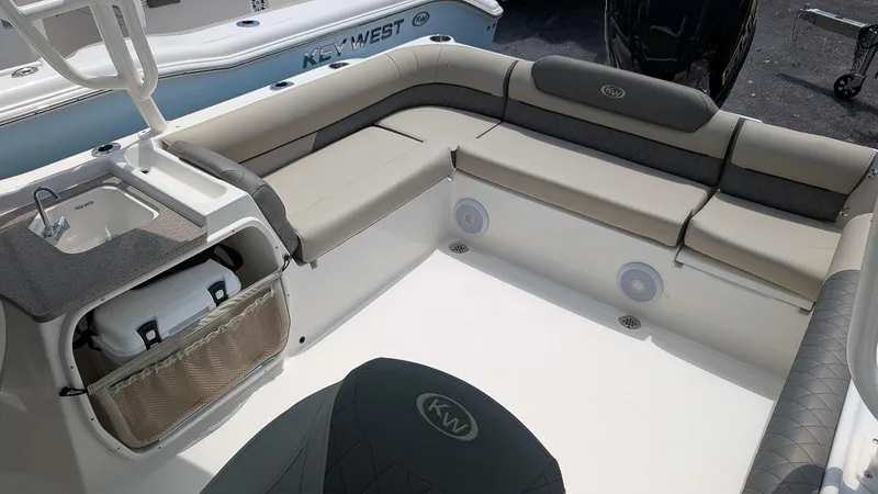 Slide: The Image of 2025 Key West 239 DFS boat interior with seating and storage. - 4