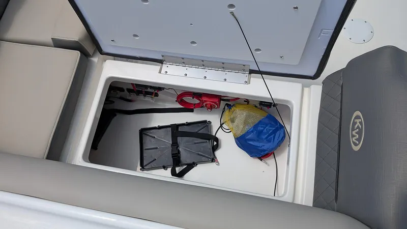 Slide: The Image of Storage compartment of 2025 Key West 239 DFS boat with gear and equipment. - 5