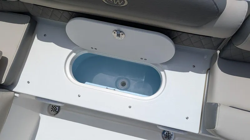 Slide: The Image of 2025 Key West 239 DFS boat interior with open storage compartment. - 6