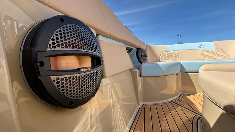 Slide: The Image of 2025 MasterCraft X26 boat interior with Klipsch speakers and luxurious seating. - 34