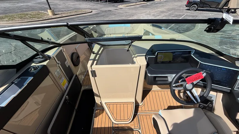 Slide: The Image of 2025 MasterCraft X26 boat interior with modern dashboard and steering wheel. - 4