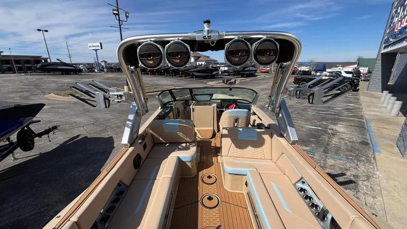 Slide: The Image of 2025 MasterCraft X26 boat interior with premium seating and advanced audio system. - 9