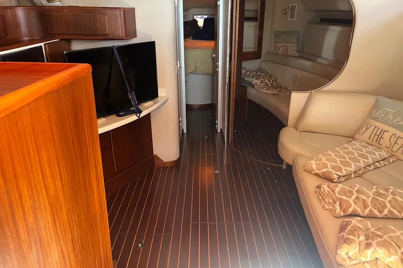 Slide: The Image of Interior of a 1994 Sea Ray 400 Express Cruiser with cozy seating and modern amenities. - 11