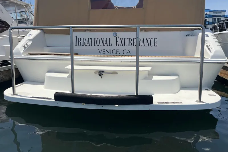 Slide: The Image of 1994 Sea Ray 400 Express Cruiser docked, named "Irrational Exuberance," Venice, CA. - 21