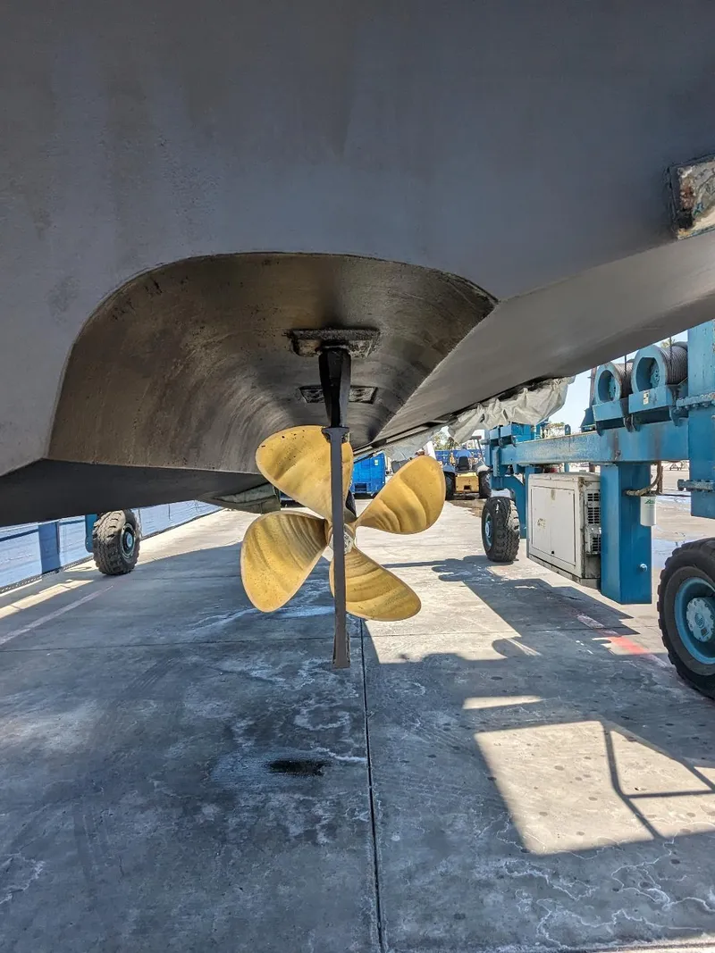 Slide: The Image of 1994 Sea Ray 400 Express boat propeller and hull in dry dock. - 23