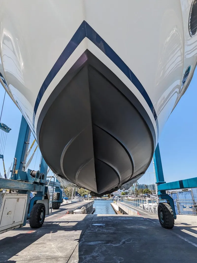Slide: The Image of 1994 Sea Ray 400 Express yacht hull in dry dock, showcasing sleek design and craftsmanship. - 24
