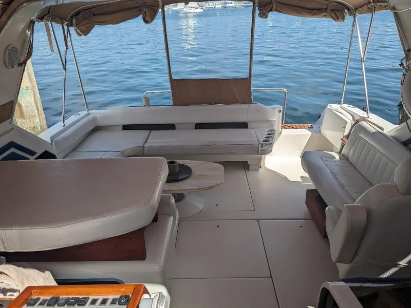 Slide: The Image of 1994 Sea Ray 400 Express yacht interior with spacious seating and ocean view. - 3