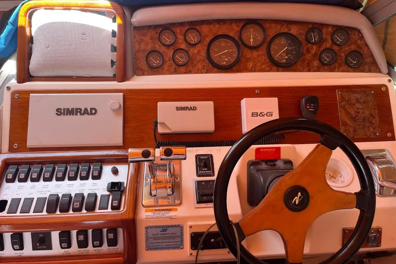 Slide: The Image of Control panel of a 1994 Sea Ray 400 Express Cruiser with Simrad and B&G equipment. - 8