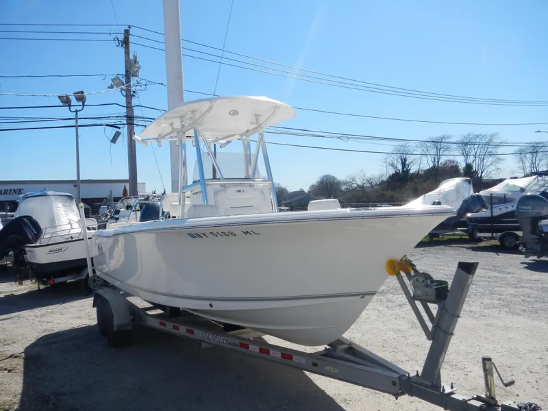 Slide: The Image of 2016 Sea Hunt Ultra 234 boat on trailer in outdoor lot. - 2