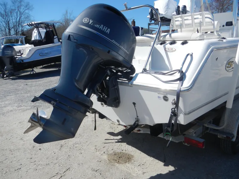 Slide: The Image of 2016 Sea Hunt Ultra 234 boat with Yamaha outboard motor, parked on a trailer. - 3