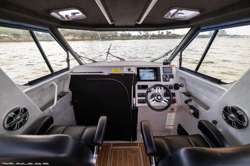 Slide: The Image of Interior of 2022 Sealegs 8.5M boat with modern dashboard and steering wheel. - 14