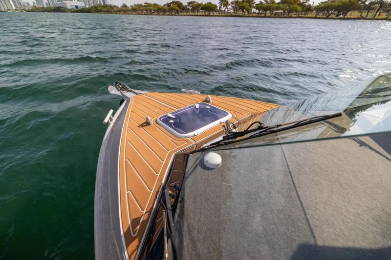 Slide: The Image of Sealegs 8.5M 2022 boat on water, featuring sleek deck design and cityscape background. - 18